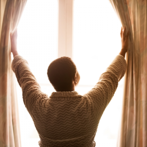 woman looking out window