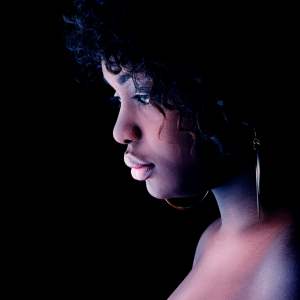 the woman looking down deep in thought