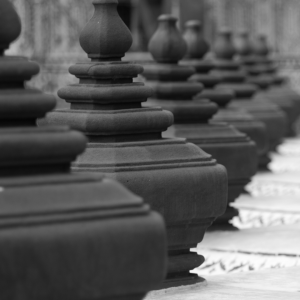 aligned black statues