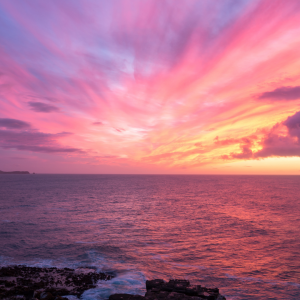 The sun rising in a beautiful purple pink sky