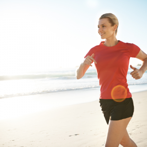 A woman taking a run on the beach