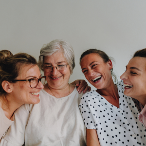 Different generation of women all together laughing