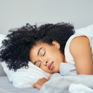 A woman laying down on her side sleeping