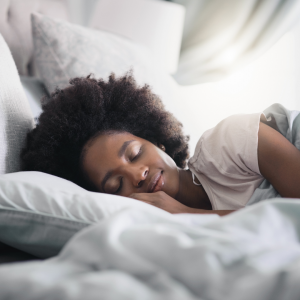 A woman smiling while she sleeps