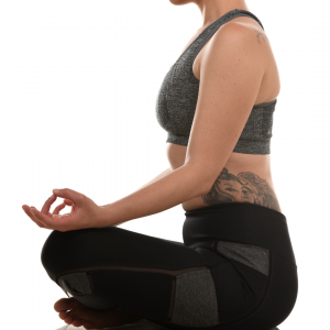 A woman sitting in yoga position
