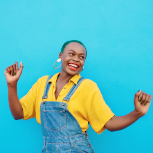 A woman confidently dancing and having a good time by herself