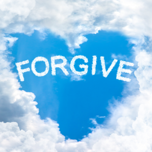 Clouds shaped in a heart with the word "Forgive" in the middle