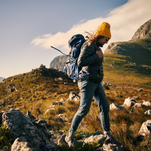 A woman hiking a trail by herself