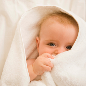 A baby wrapped in a blanket